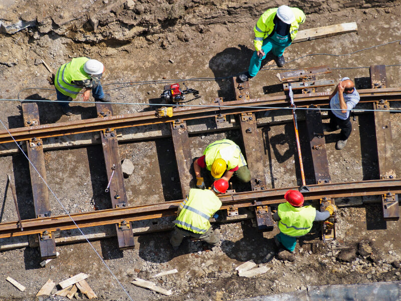 Aerial view of workers on railways construction site.